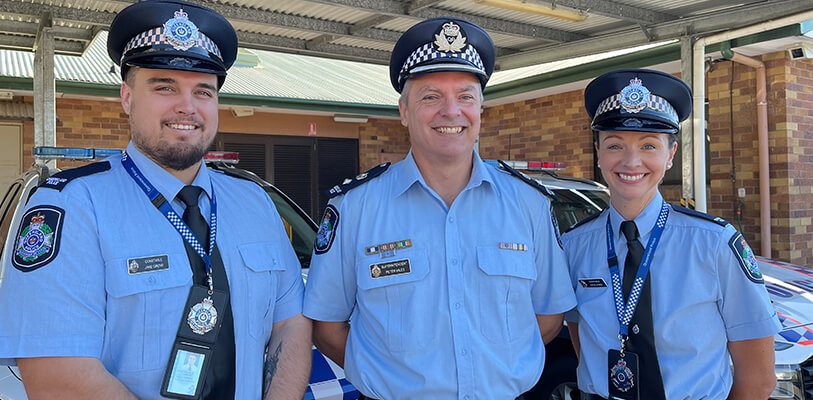 New Gold Coast QPS recruits Jake Gove and Katie Jones with Superintendent Peter Miles 