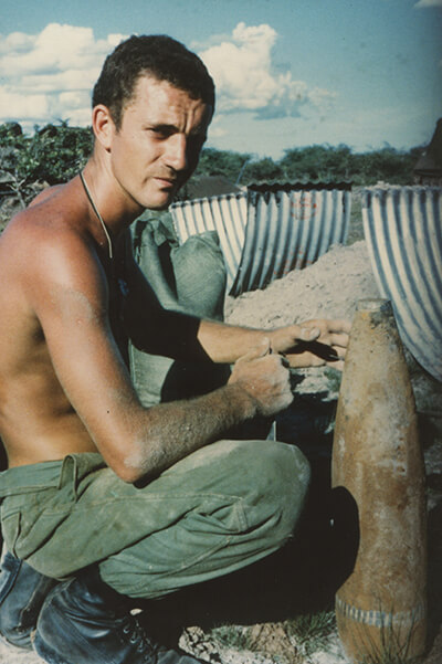 Robert with an unexploded shell 
