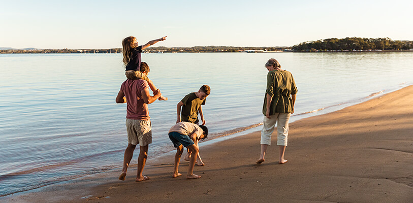 A joyful family enjoying a sunny day at the beach