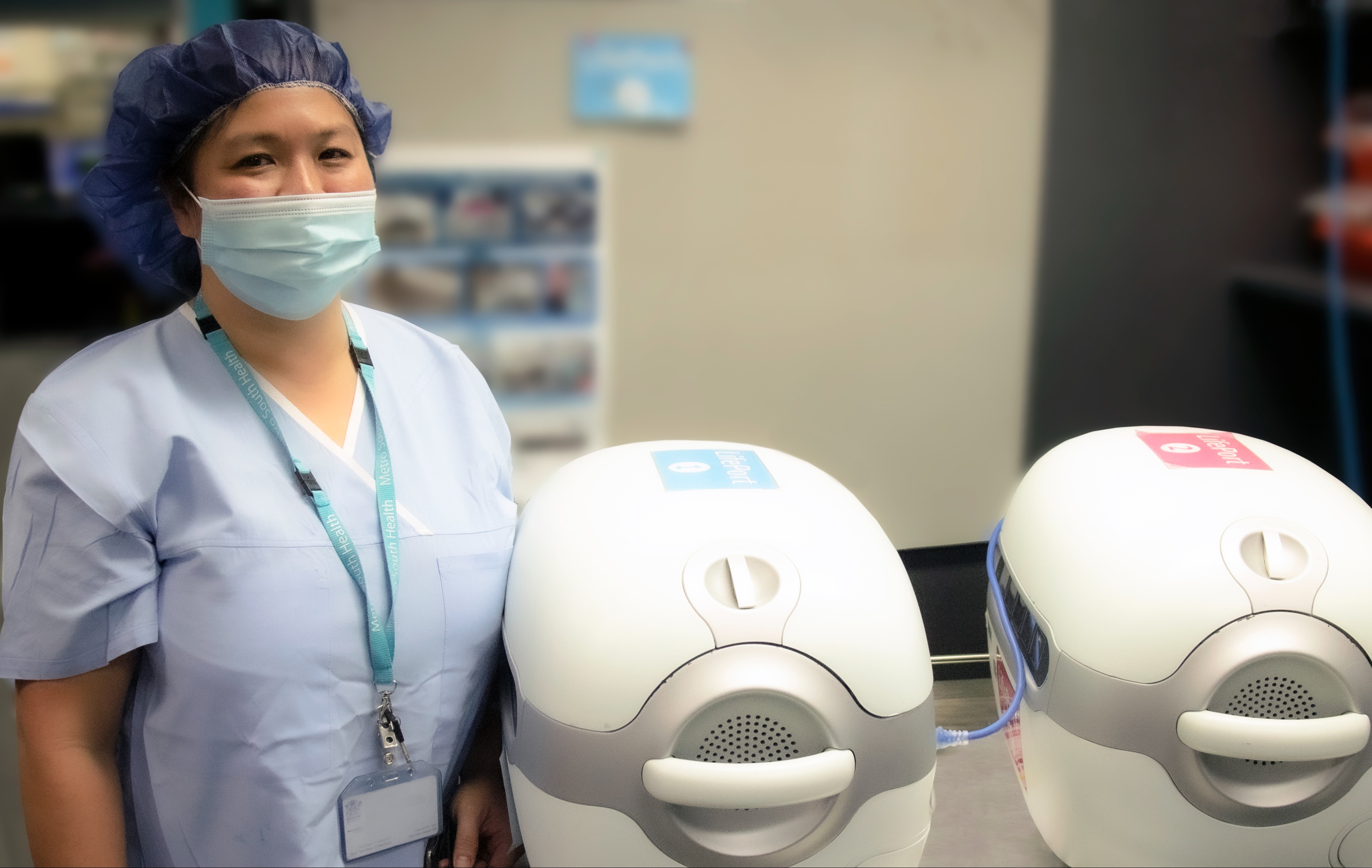 Photo of Dr Ai Lin Tan with Lifeport organ transportation capsules