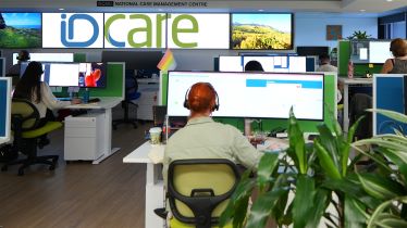 A call centre with people working on computers