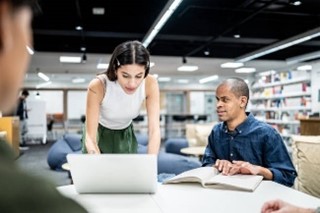 Man and woman working at a desk